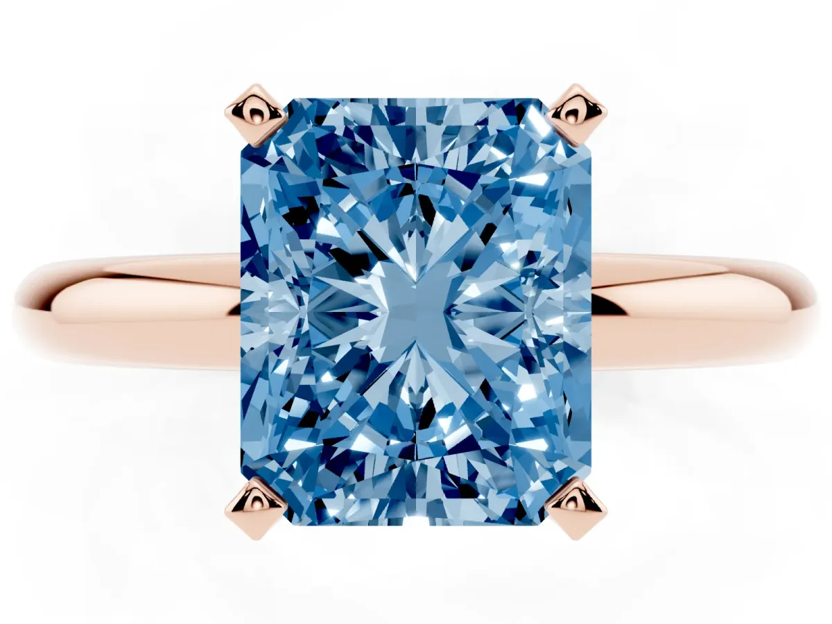 Fancy Blue Radiant Cut Diamond Solitaire Engagement Ring with Round Band and Four-Prong Setting Rose gold