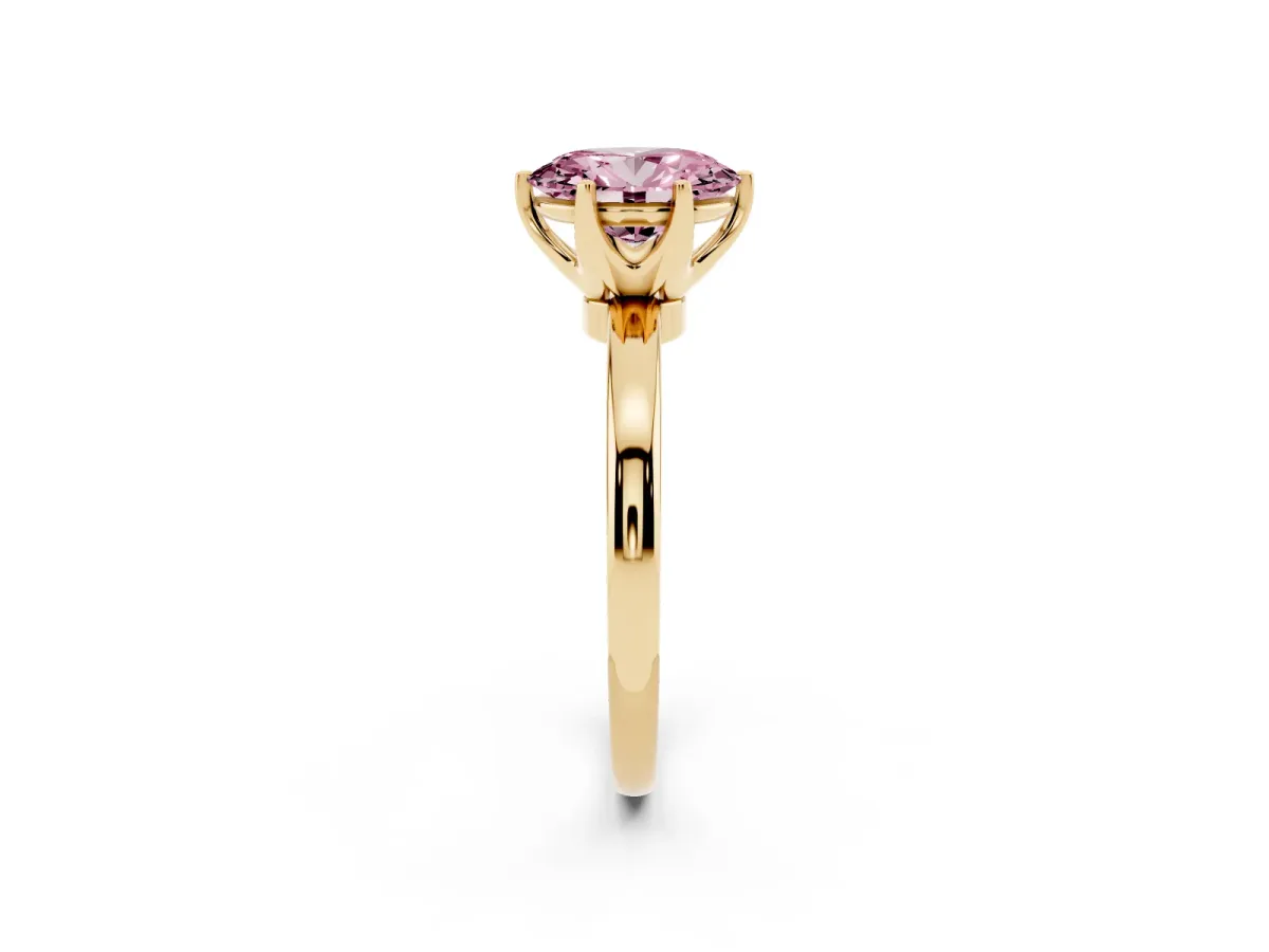 Fancy Pink Oval Cut Solitaire Diamond Ring with Six-Prong Setting on a Classic Band Yellow gold