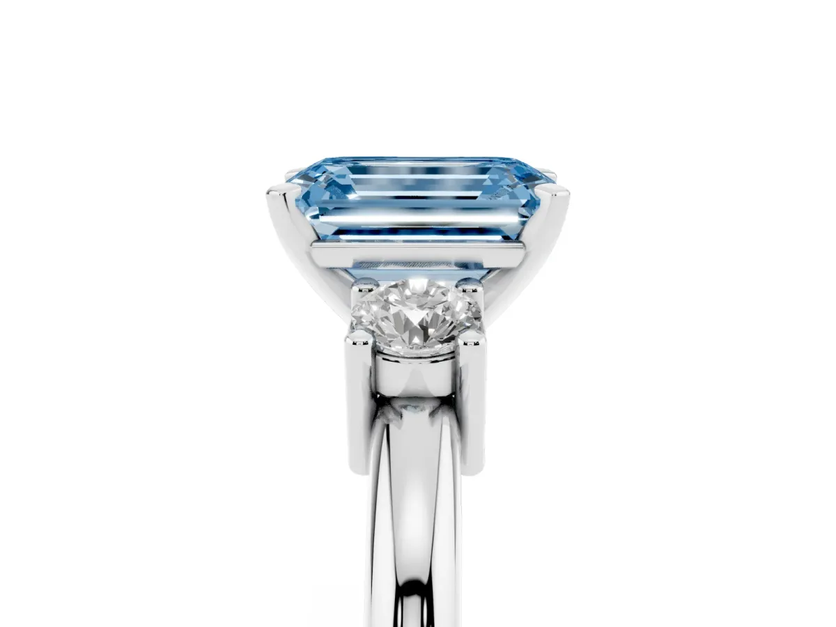 Fancy Blue Three-Stone Emerald Cut Cut Diamond Solitaire with Prong Setting and Classic Band Silver