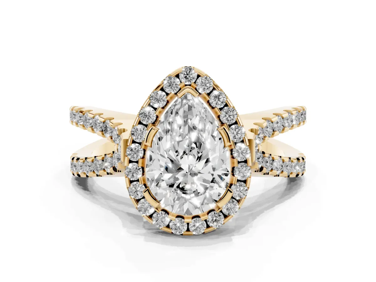 Pear Cut Diamond Halo Ring with Split Shank Pavé Band and Prong Setting Yellow gold