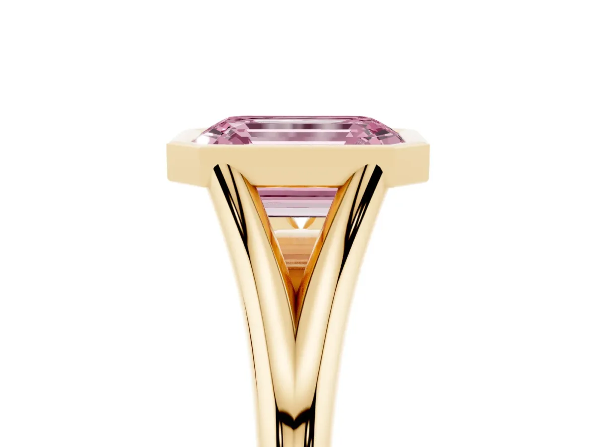 Fancy Pink Bezel Set Emerald Cut Cut Solitaire Ring with Tapered Band Yellow gold