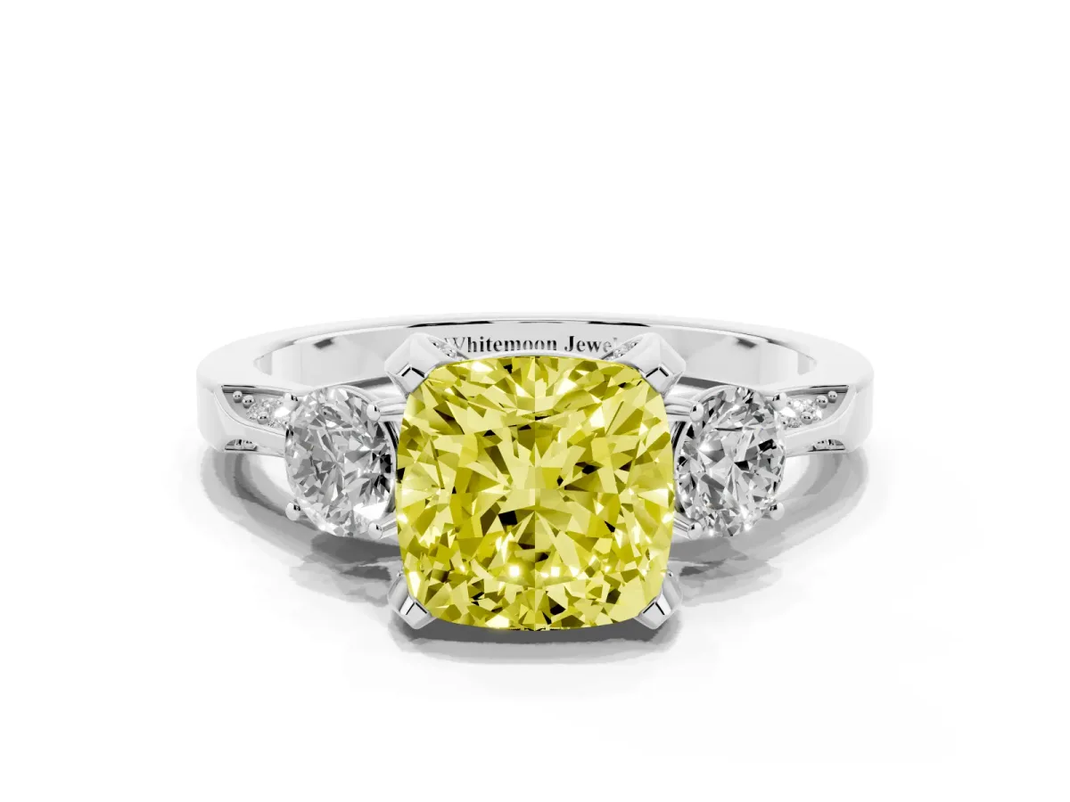 Fancy Yellow Cushion Cut Brilliant Three-Stone Diamond Ring with Pavé Band and Four-Prong Setting Platinum