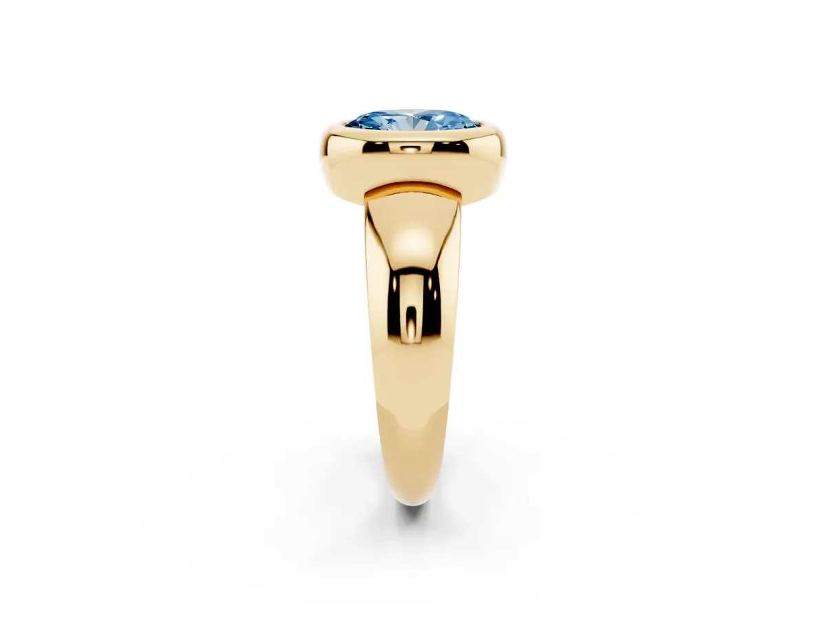 Fancy Blue Bezel Set Oval Cut Solitaire Ring with Wide Band Yellow gold