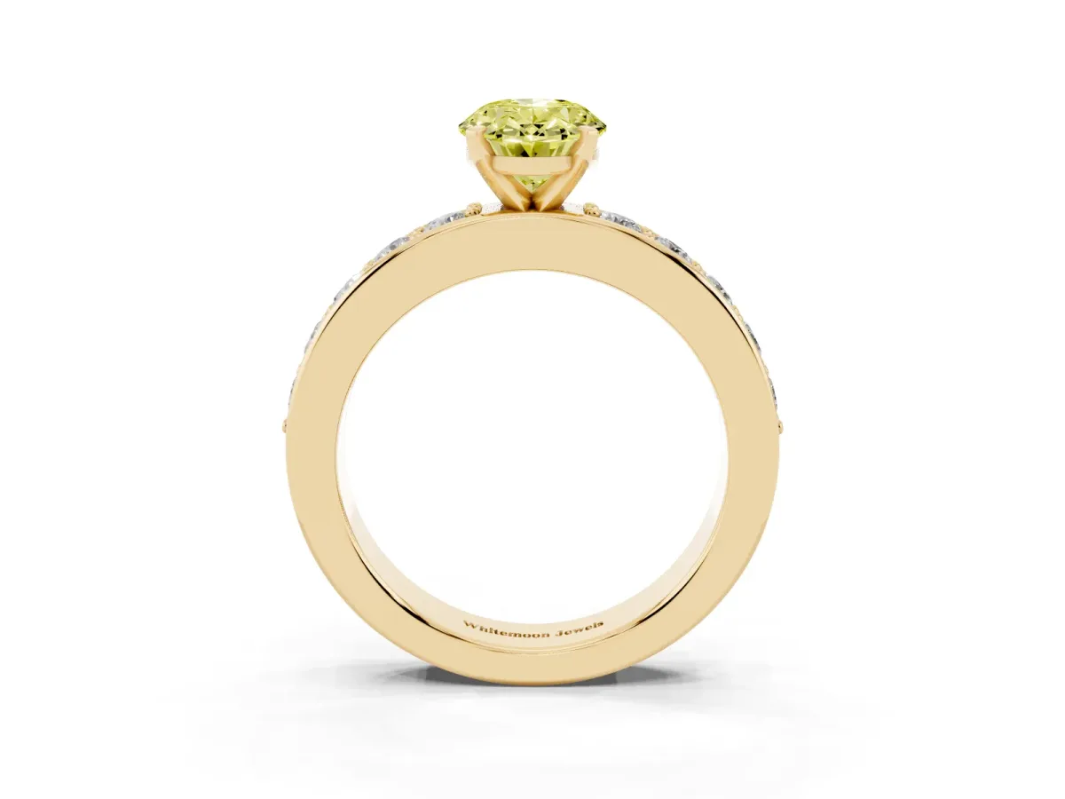 Fancy Yellow Oval Cut Diamond Engagement Ring with Channel Set Round Band and Prong Setting Yellow gold