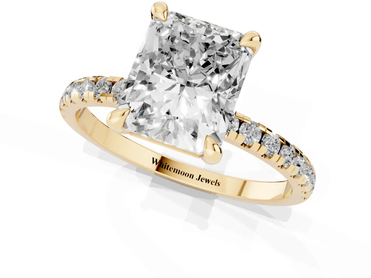 Radiant Cut Diamond Brilliant Solitaire Ring with Pavé Band and Four-Prong Setting Yellow gold
