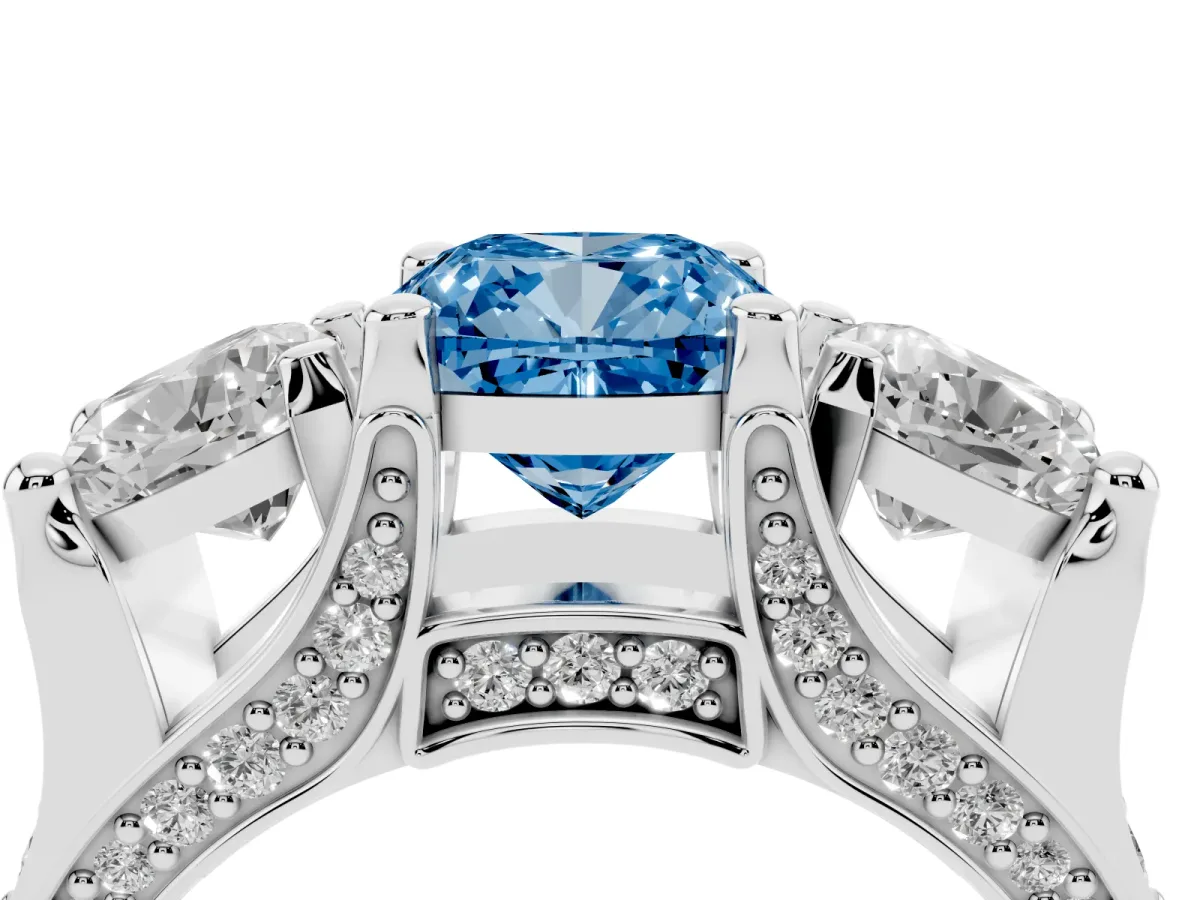 Fancy Blue Cushion Cut Diamond Three-Stone Ring with Channel Set Band and Four-Prong Setting Silver
