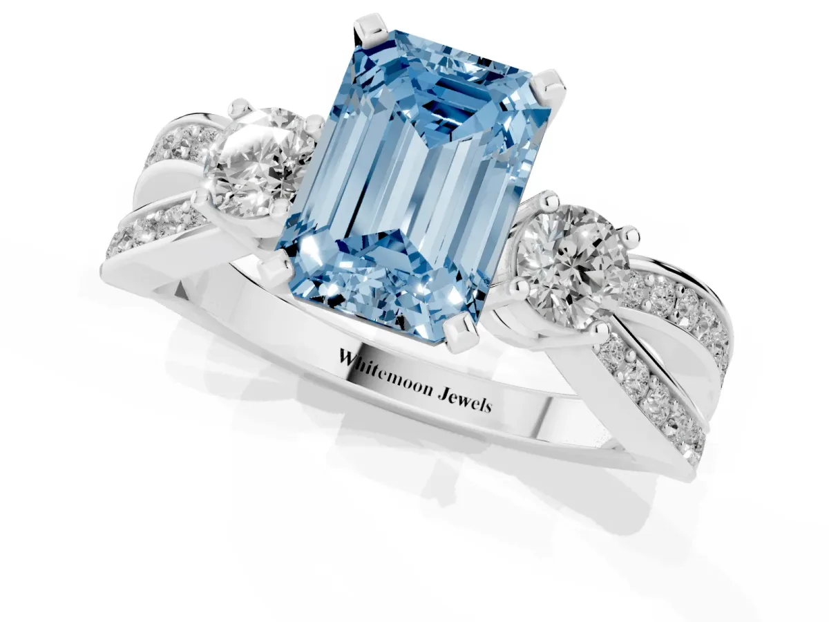 Fancy Blue Three-Stone Emerald Cut Cut Diamond Twist Band with Prong Setting Platinum