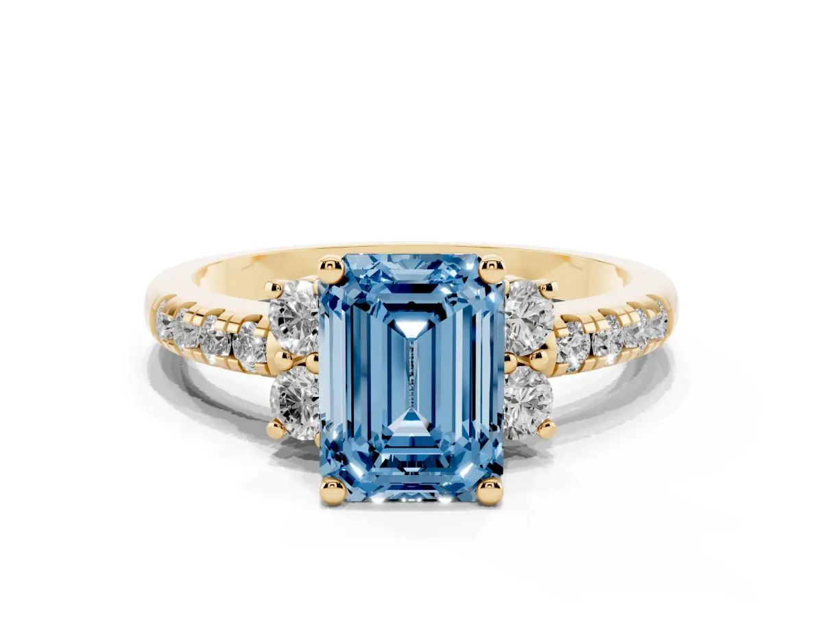 Fancy Blue Emerald Cut Diamond Three-Stone Pave Band with Four-Prong Setting Yellow gold