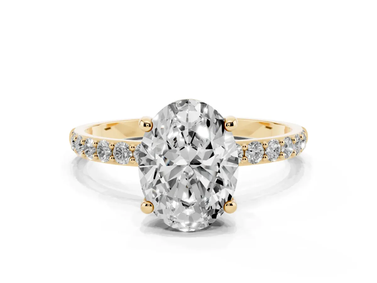 Oval Cut Diamond Solitaire Ring with Round Pavé Band and Prong Setting Yellow gold