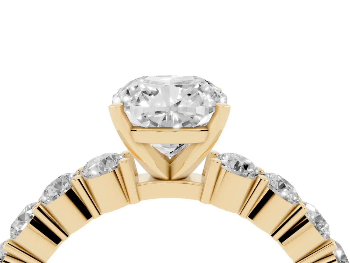 Cushion Cut Diamond Solitaire Ring with Shared Prong Round Side Stones Yellow gold