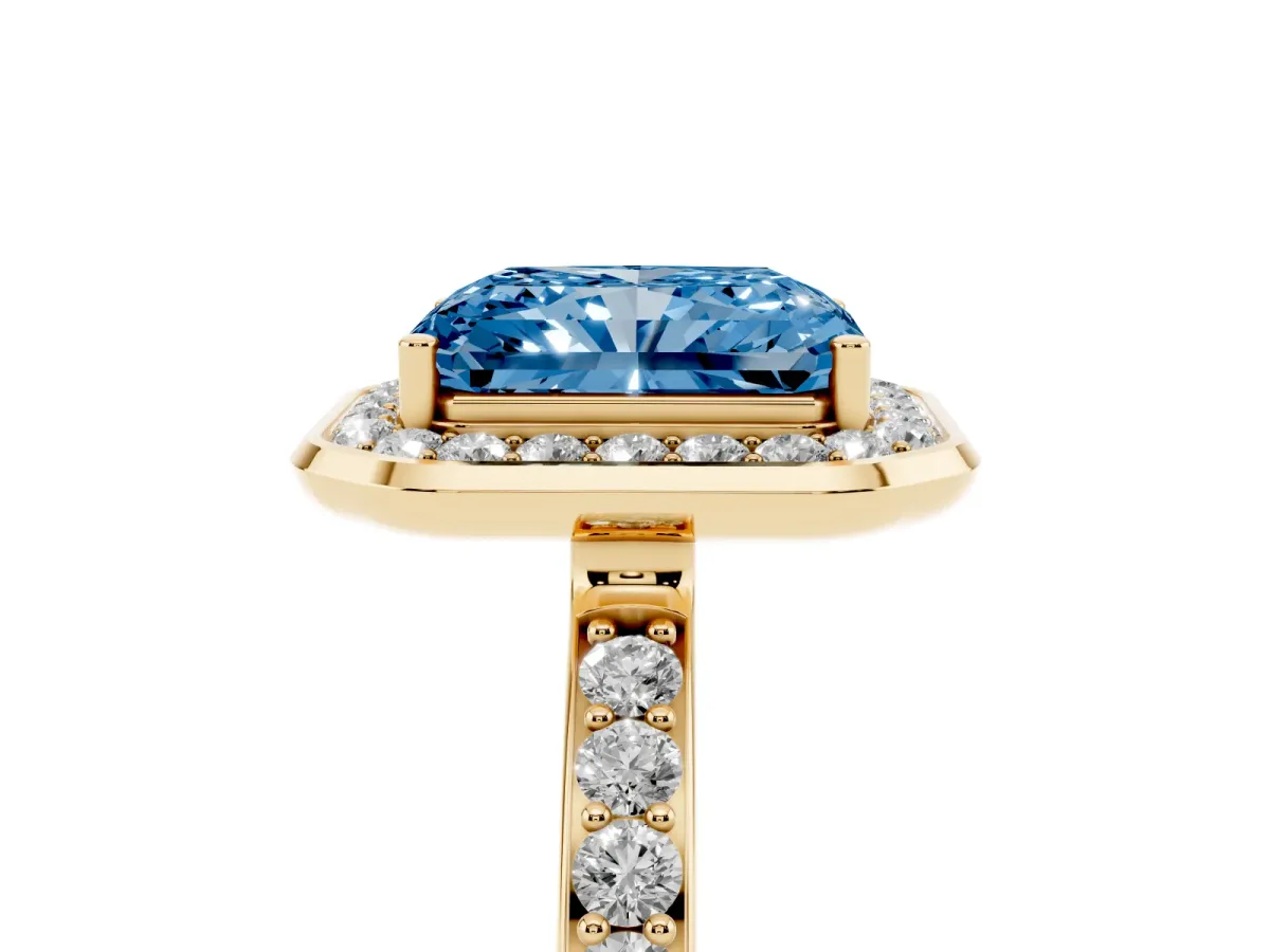 Fancy Blue Radiant Cut Diamond Halo Ring with Bezel Frame and Pavé Band Yellow gold