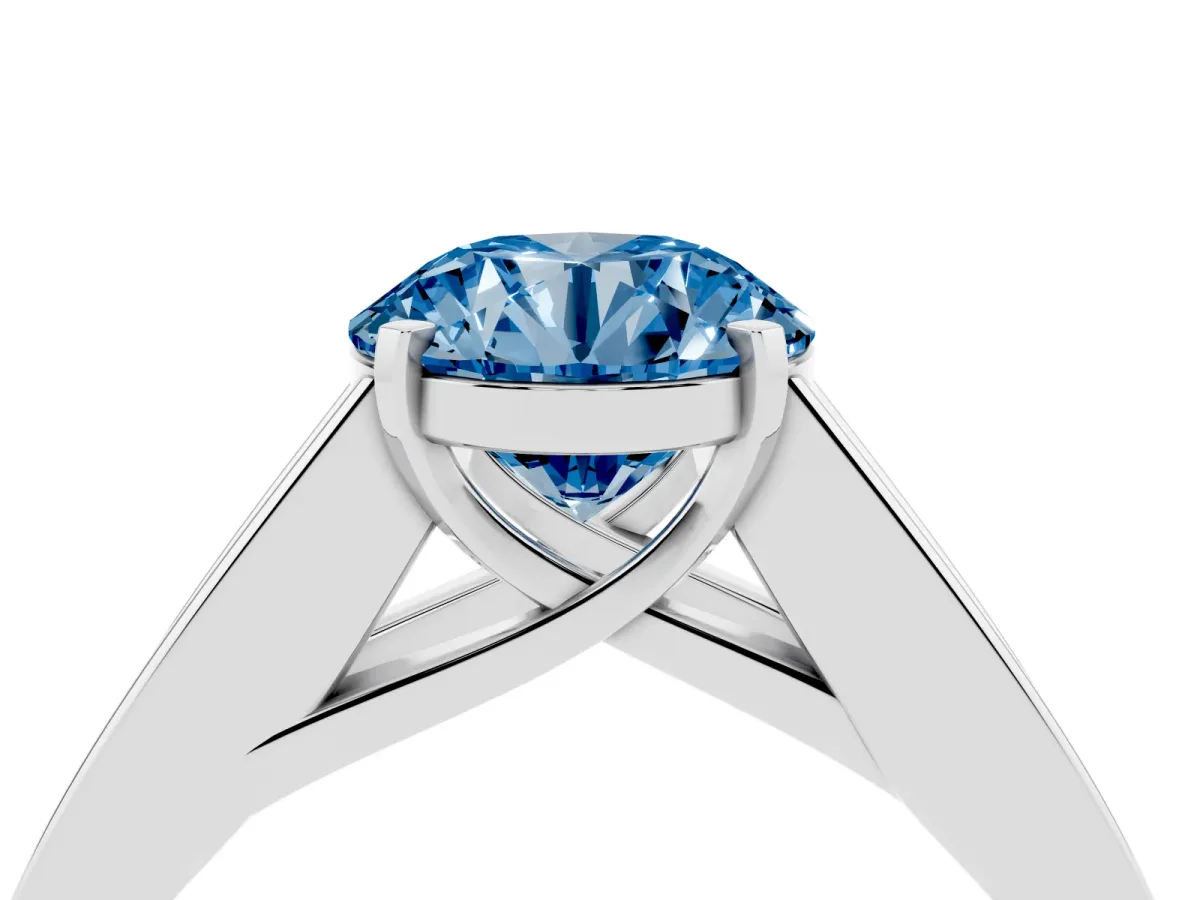 Fancy Blue Round Cut Cut Channel Set Solitaire Ring with Four-Prong Setting Silver