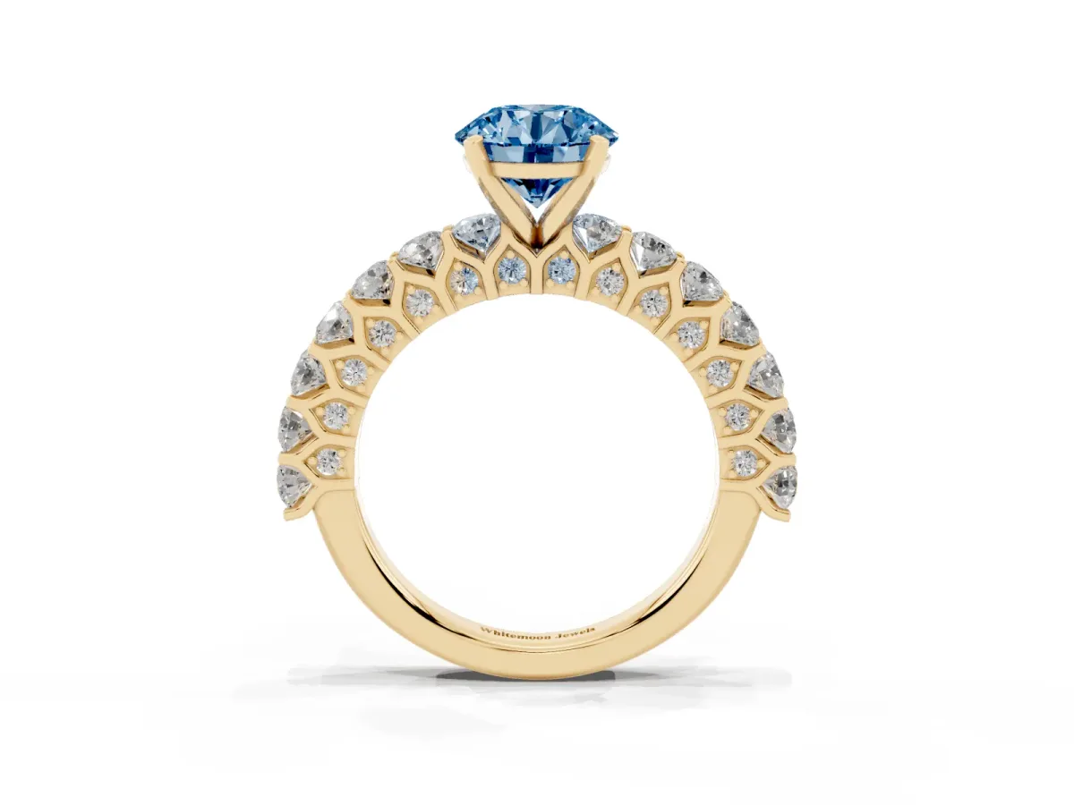 Fancy Blue Round Cut Diamond Solitaire Ring with Shared Prong Pavé Band and Four-Prong Setting Yellow gold