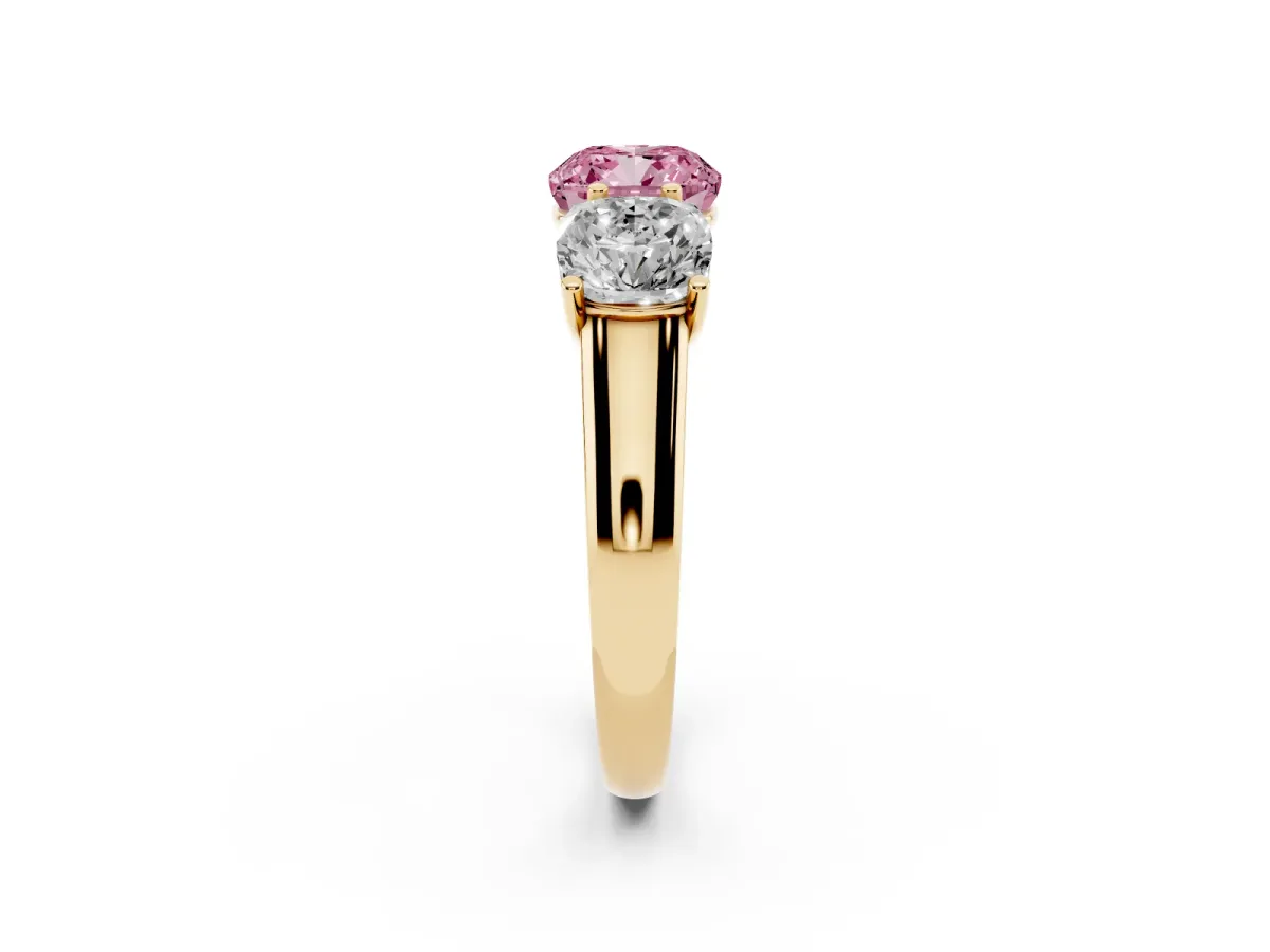 Fancy Pink Cushion Cut Three-Stone Diamond Ring with Prong Setting on a Classic Band Yellow gold