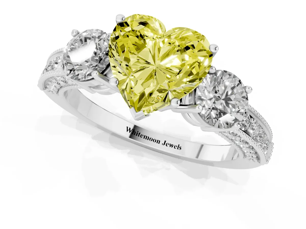 Fancy Yellow Heart Cut Three-Stone Diamond Ring with Pavé Band and Four-Prong Setting Silver