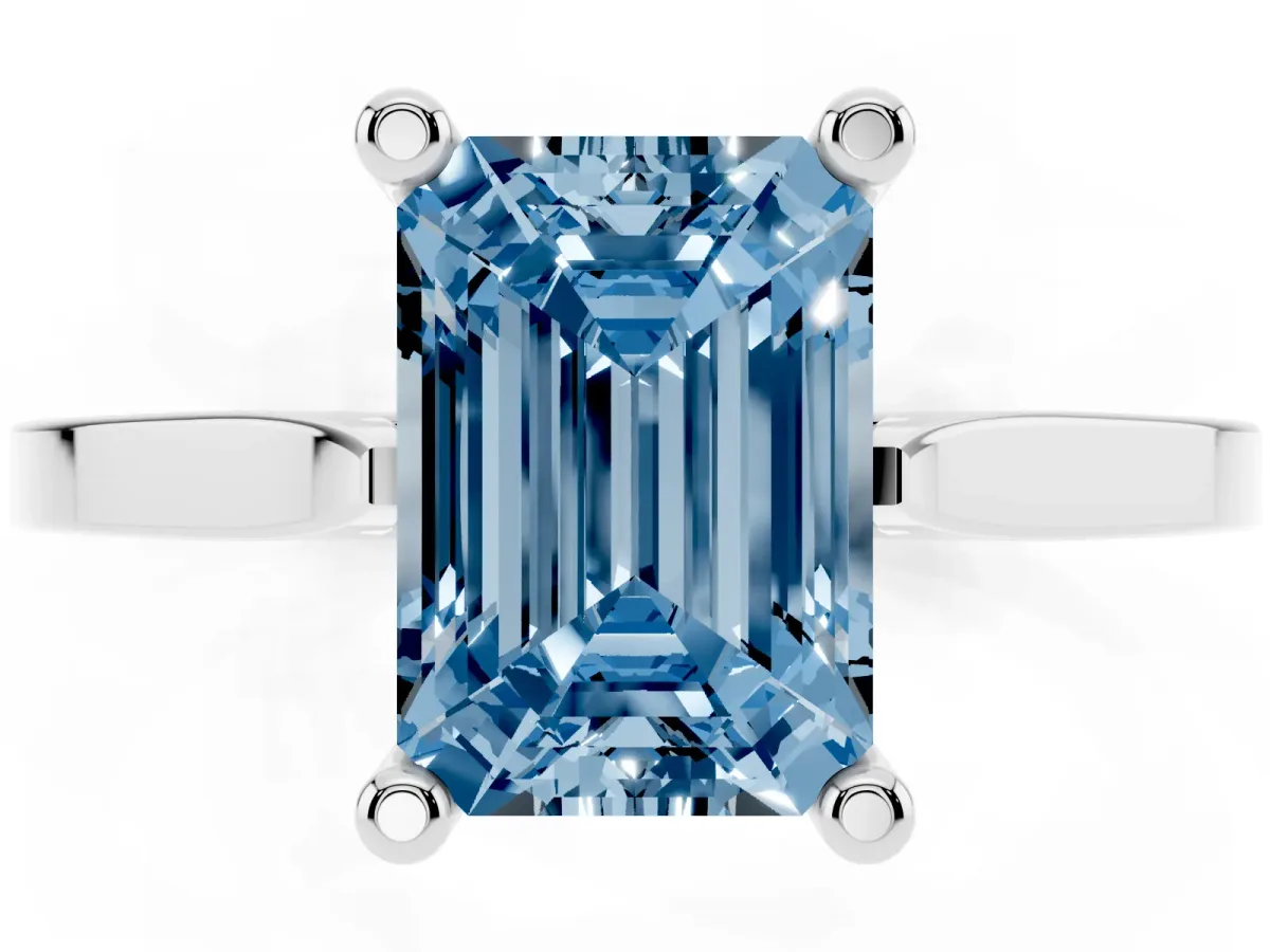 Fancy Blue Emerald Cut Solitaire Diamond Ring with Four-Prong Setting and Tapered Band Silver