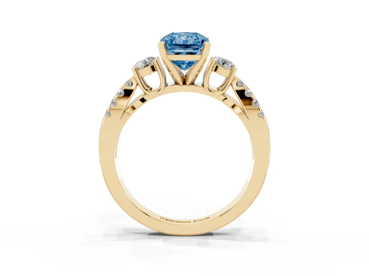 Fancy Blue Radiant Cut Diamond Three-Stone Ring with Pavé Split Shank and Four-Prong Setting Yellow gold