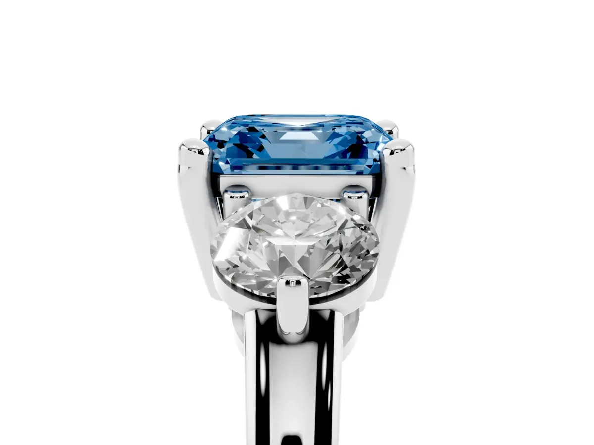 Fancy Blue Three-Stone Asscher Cut Brilliant Cut Solitaire Ring with Prong Setting on a Classic Band Platinum