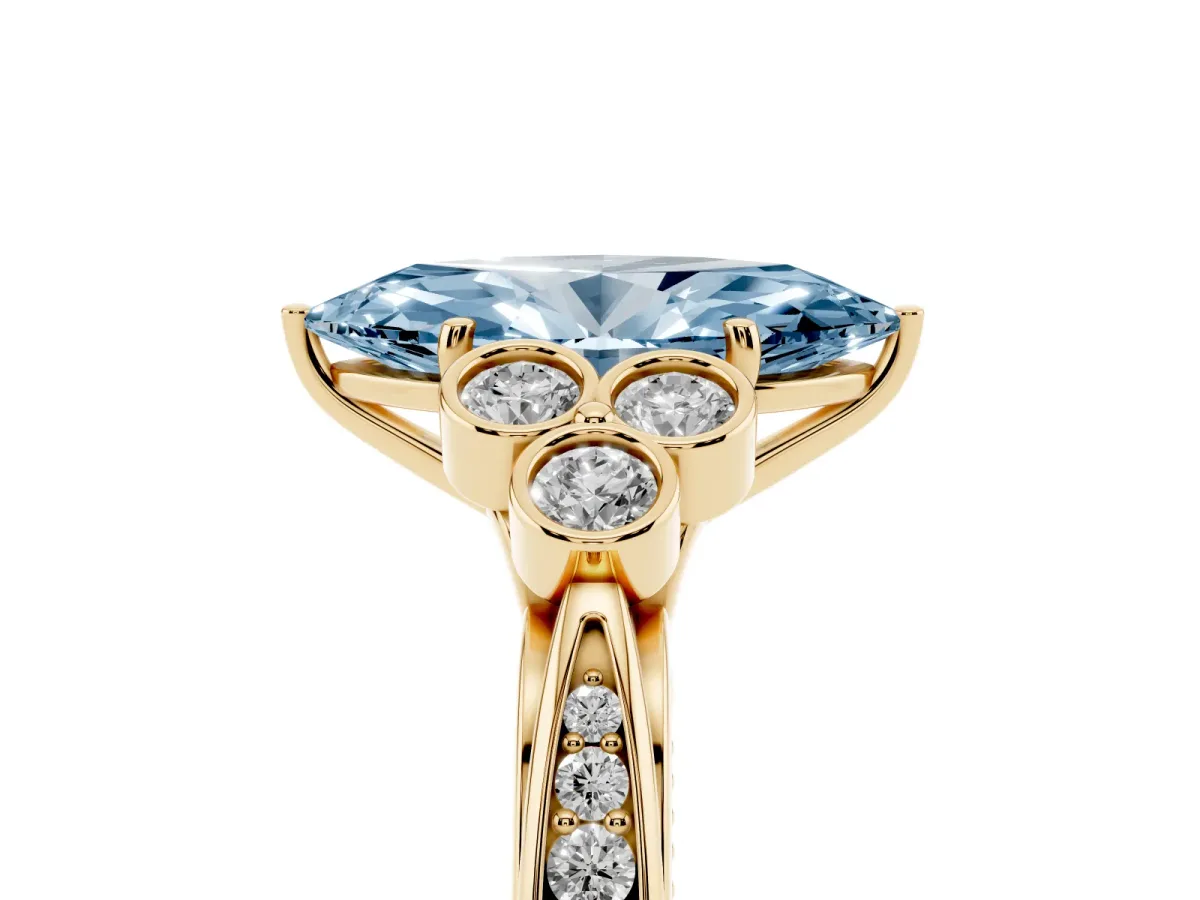 Fancy Blue Marquise Cut Cut Diamond Engagement Ring with Bezel Set Round Side Stones and Prong Setting Yellow gold