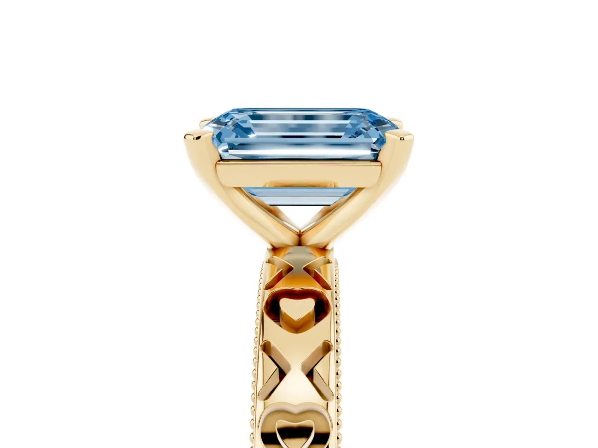 Fancy Blue Emerald Cut Solitaire Diamond Engagement Ring with XO Engraved Band and Four-Prong Setting Yellow gold