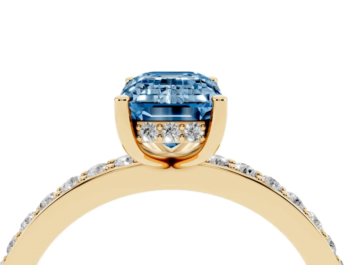 Fancy Blue Emerald Cut Cut Diamond Pavé Band Ring with Four-Prong Setting Yellow gold