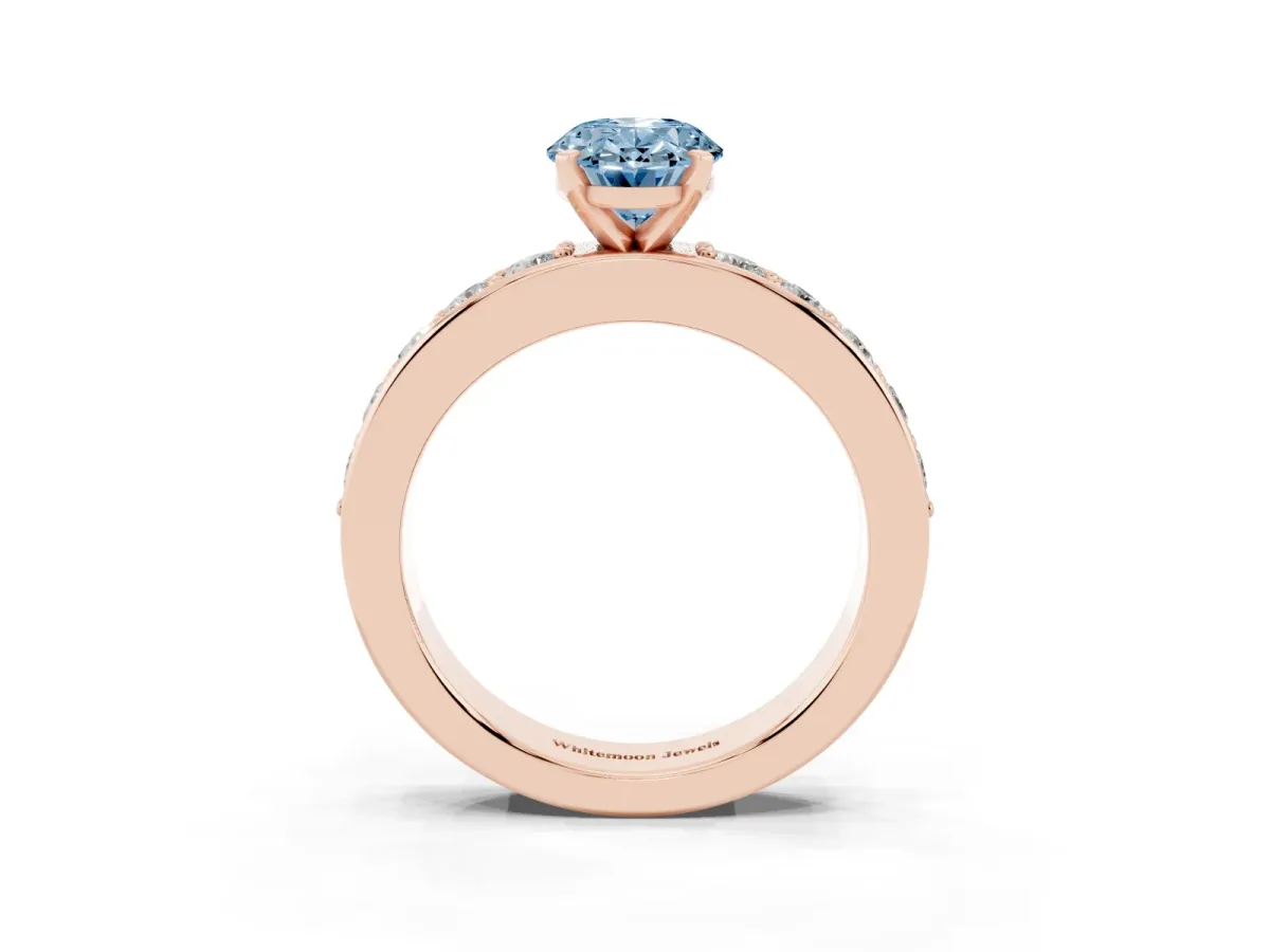 Fancy Blue Oval Cut Diamond Engagement Ring with Channel Set Round Band and Prong Setting Rose gold