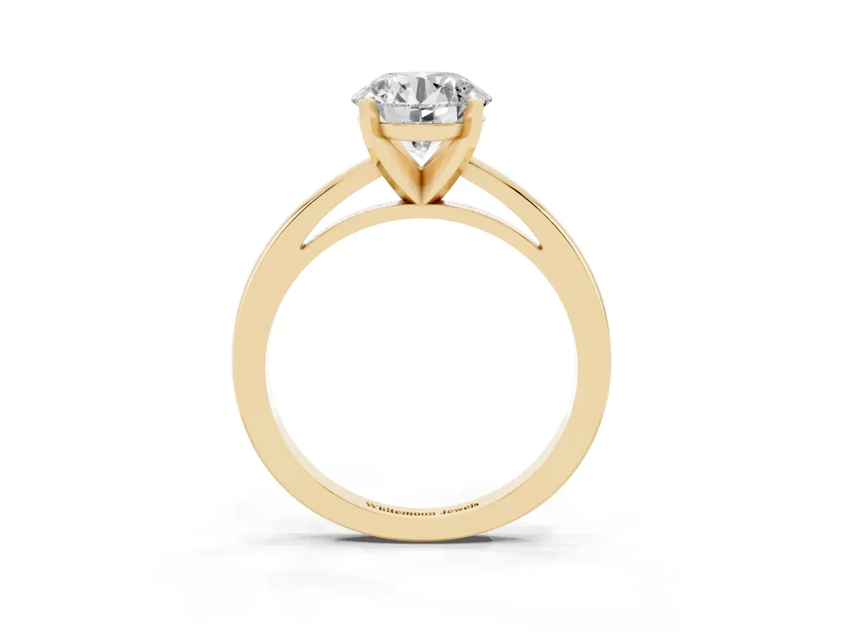 Round Cut Solitaire Diamond Engagement Ring with Four-Prong Setting on a Classic Band Yellow gold