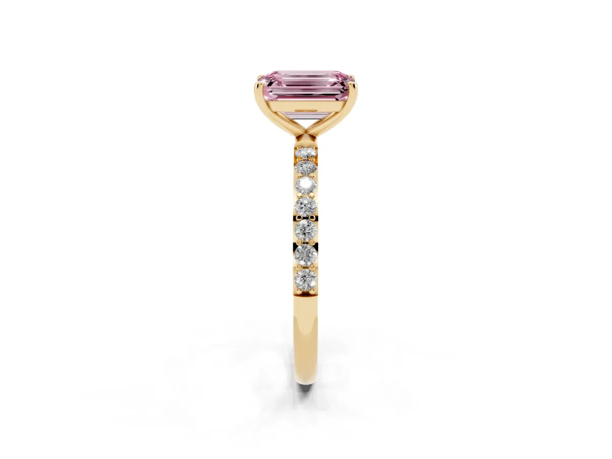 Fancy Pink Emerald Cut Diamond Solitaire Ring with Round Pavé Shoulders and Prong Setting Yellow gold