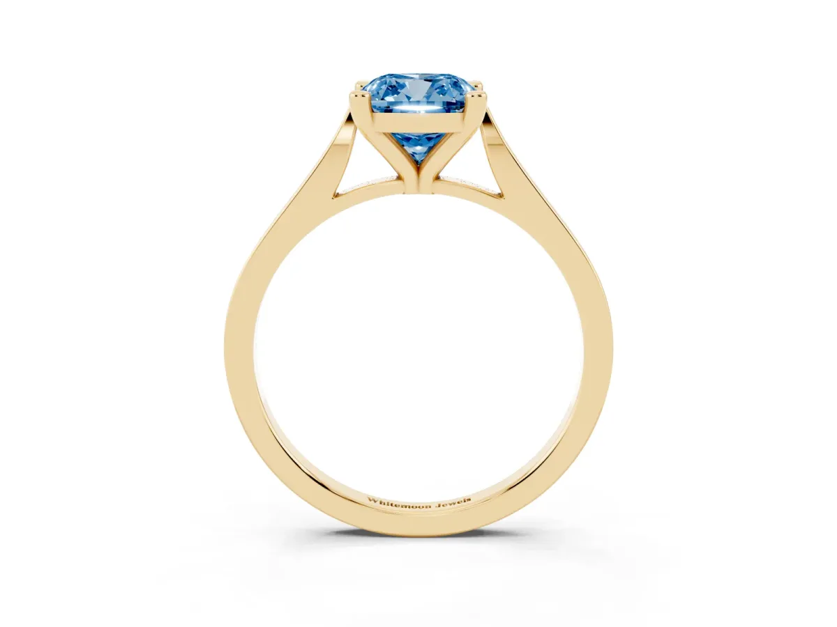 Fancy Blue Cushion Cut Solitaire Diamond Ring with Four-Prong Setting and Tapered Band Yellow gold