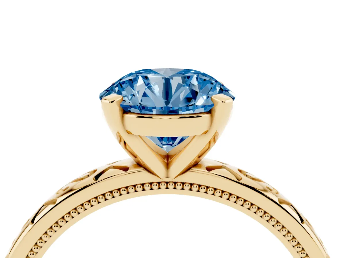 Fancy Blue Round Cut Solitaire Engagement Ring with Scrollwork Band and Four-Prong Setting Yellow gold