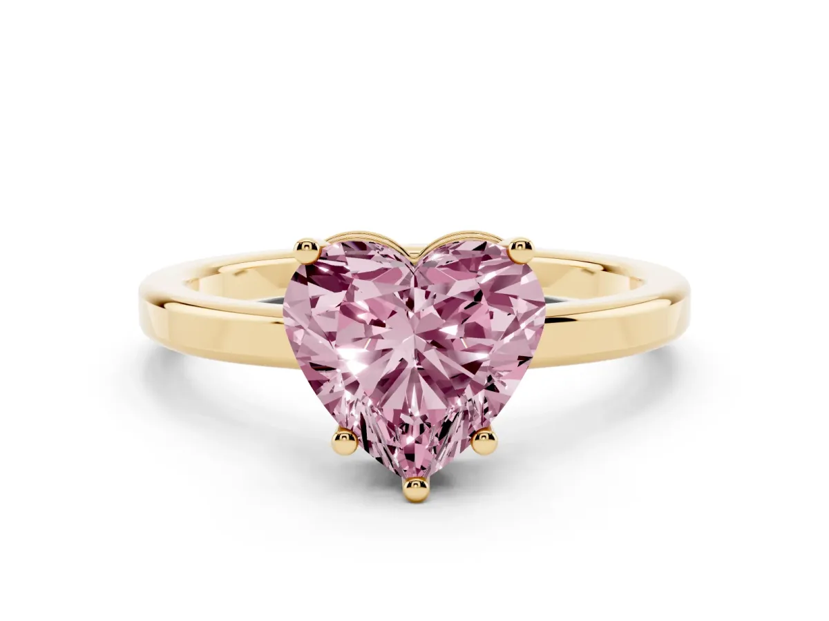 Fancy Pink Heart Cut Cut Solitaire Engagement Ring with Four-Prong Setting on a Classic Band Yellow gold