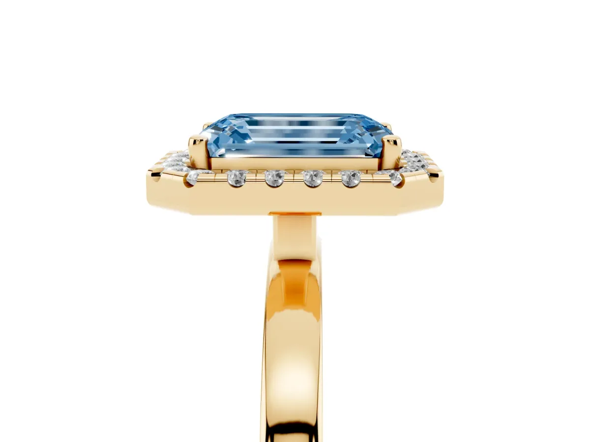 Fancy Blue Emerald Cut Halo Diamond Solitaire with Pavé Band and Four-Prong Setting Yellow gold