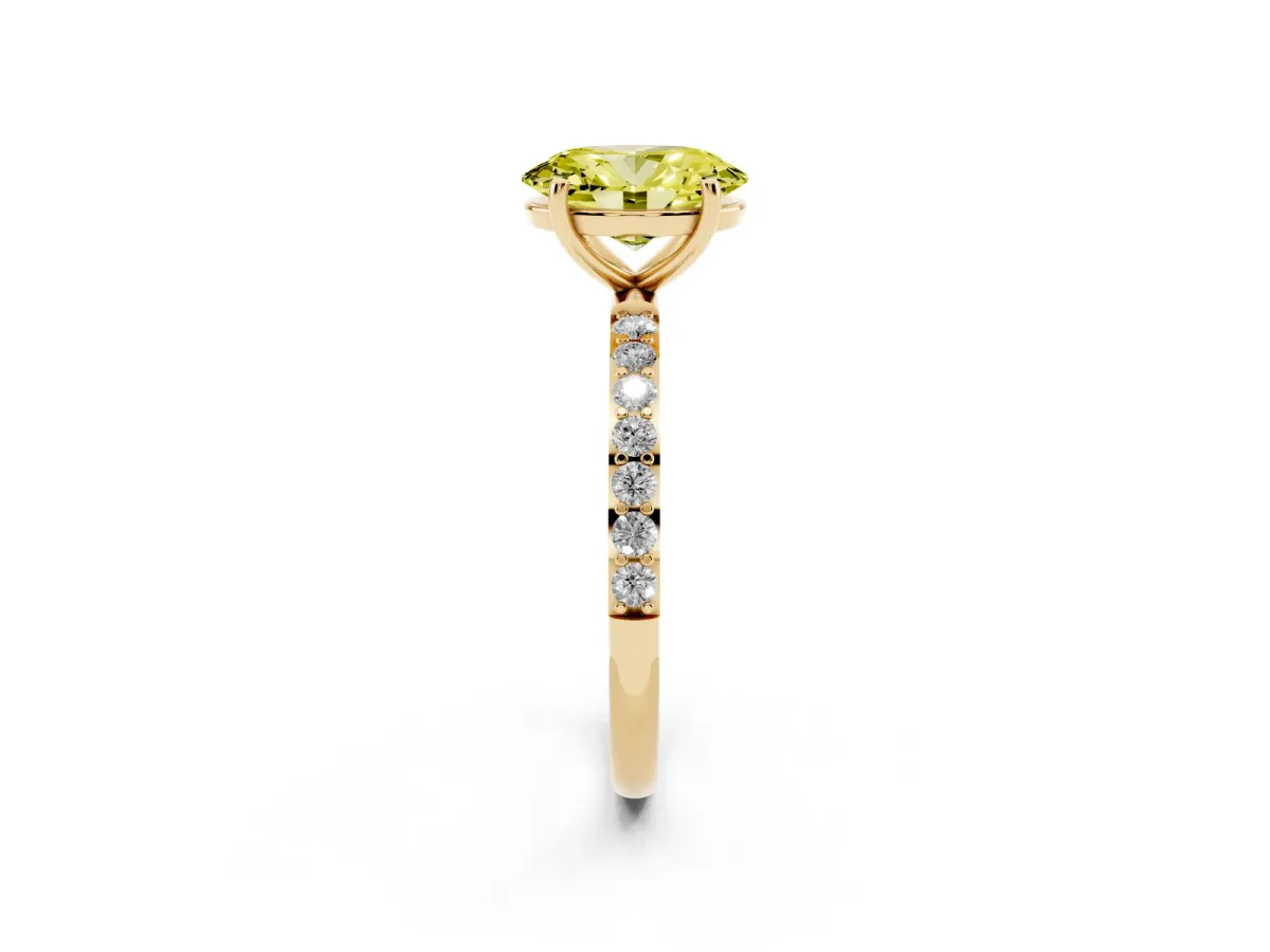 Fancy Yellow Oval Cut Diamond Solitaire Ring with Round Pavé Shoulders and Prong Setting Yellow gold