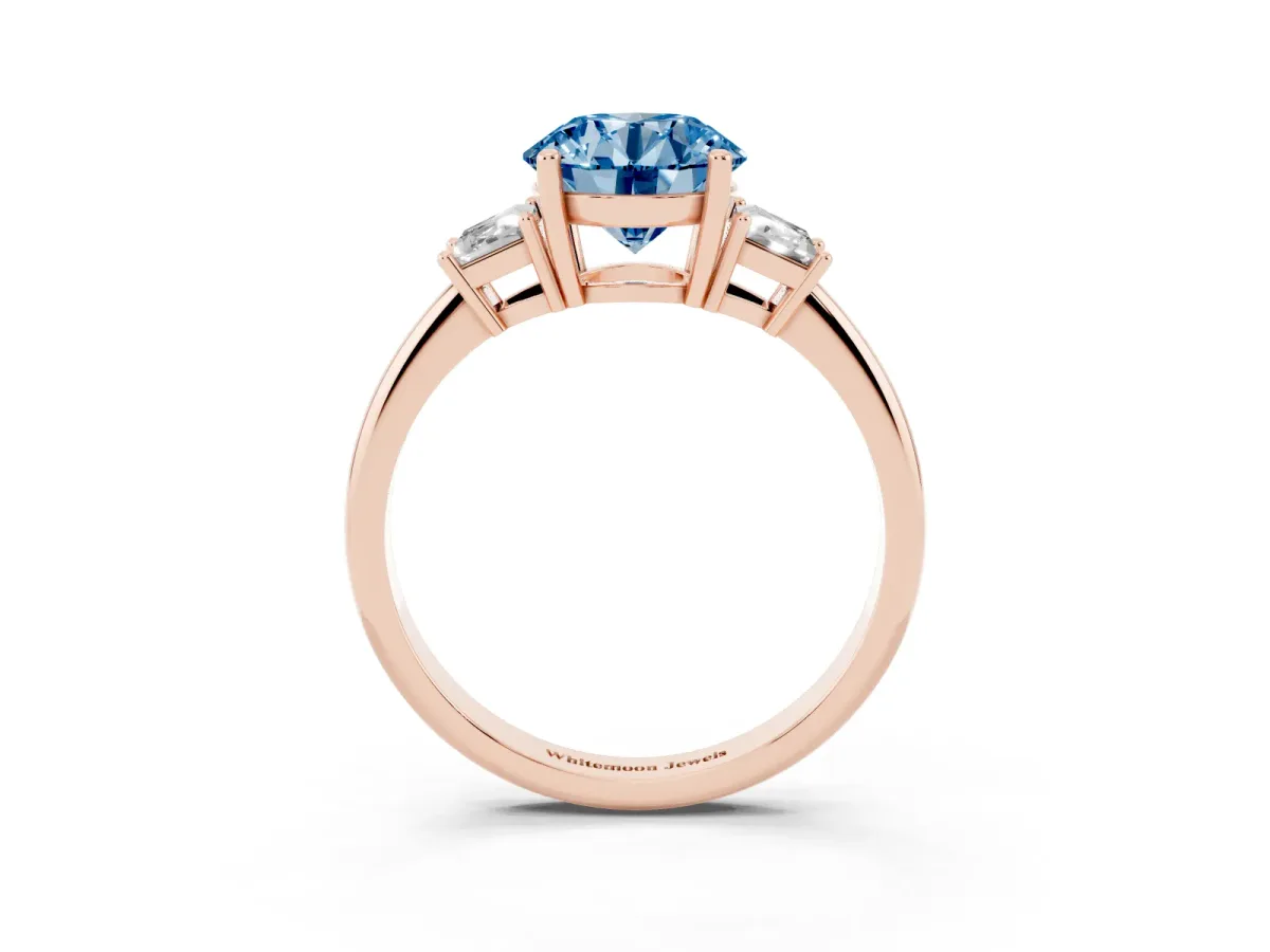 Fancy Blue Round Cut Diamond Three-Stone Ring with Trapezoid Side Stones and Prong Setting Rose gold
