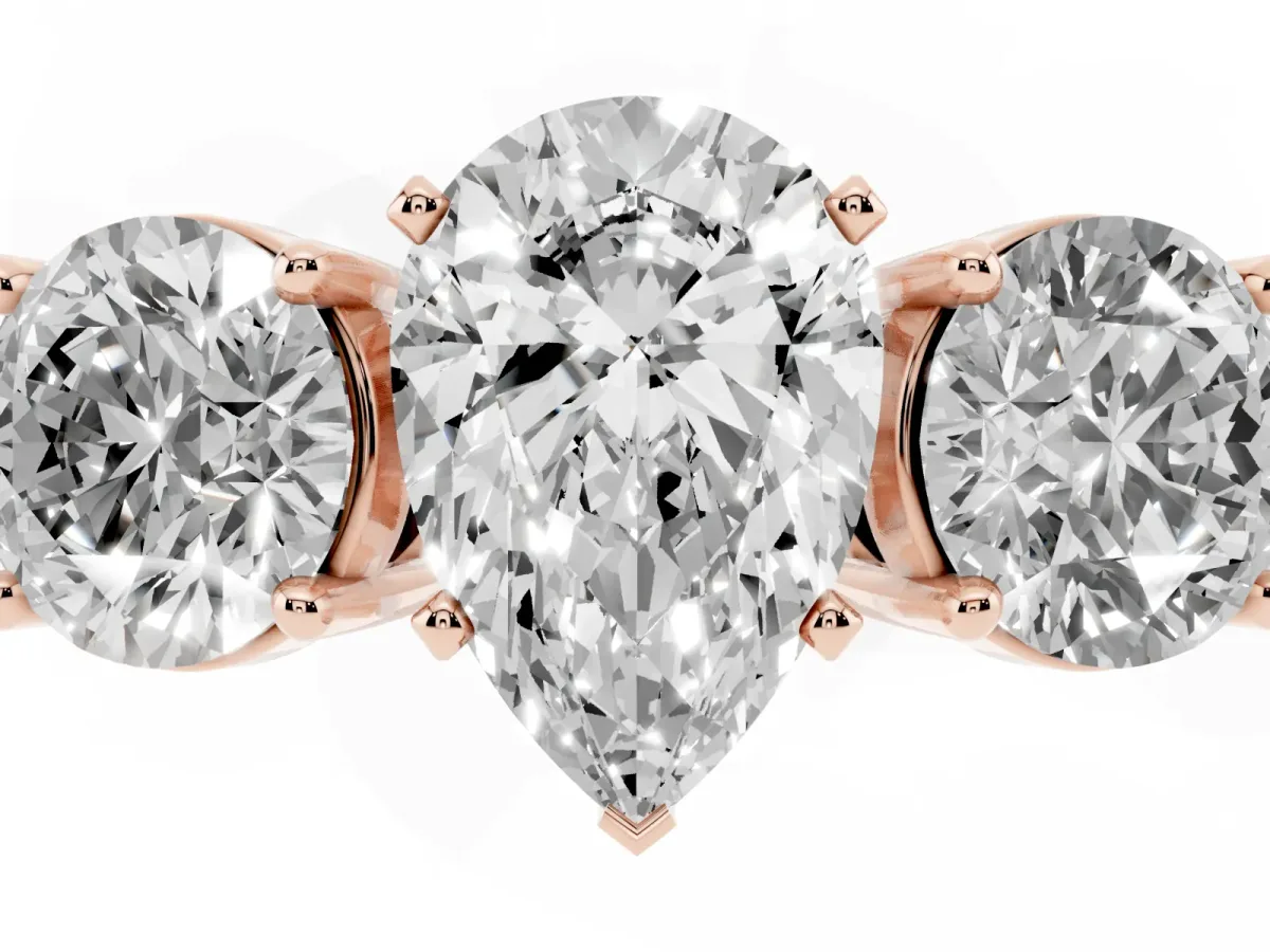 Three-Stone Pear Cut Diamond Ring with Round Side Stones, Classic Band, and Four-Prong Setting Rose gold