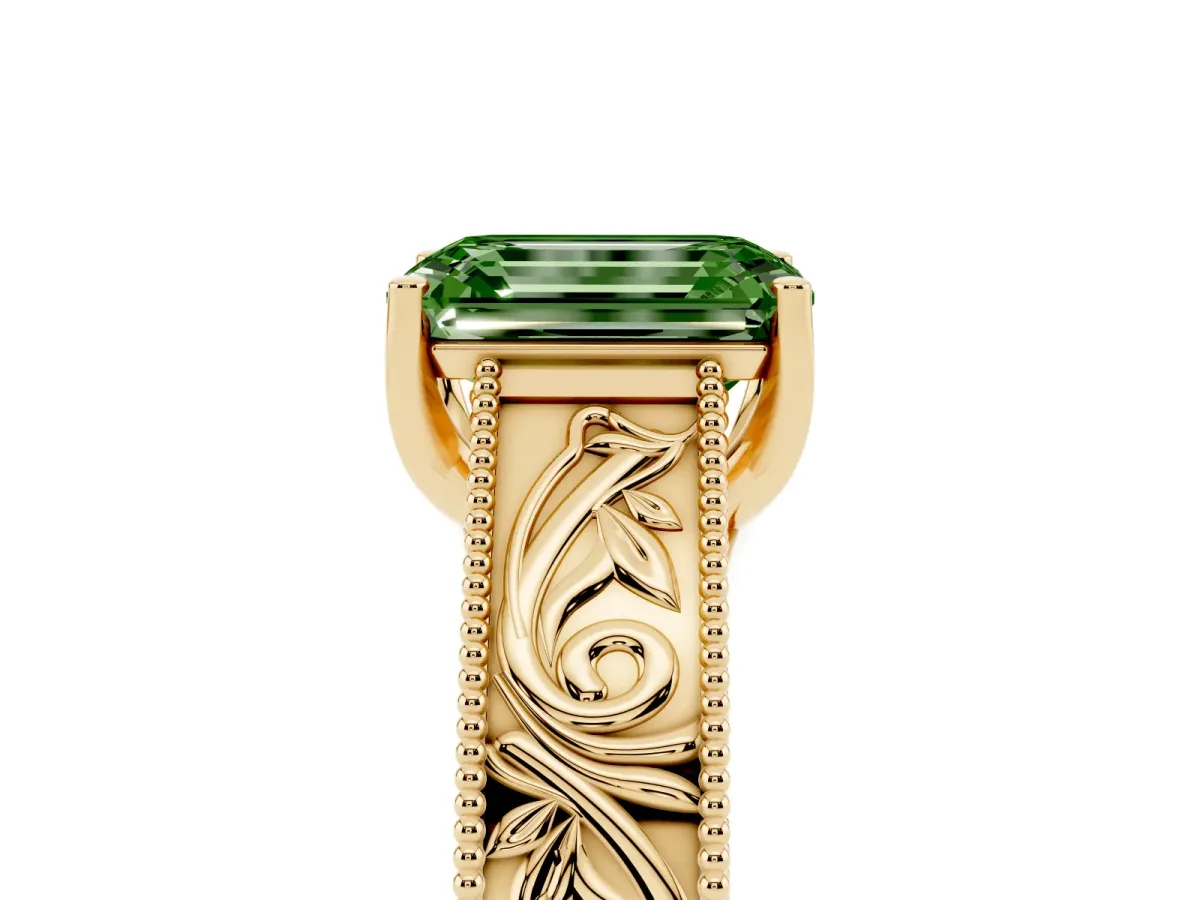 Fancy Green Emerald Cut Diamond Solitaire Ring with Engraved Band and Four-Prong Setting Yellow gold