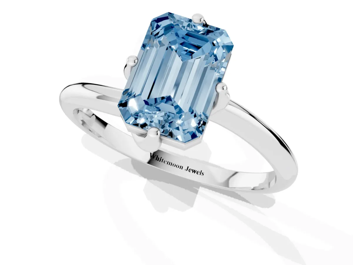 Fancy Blue Emerald Cut Diamond Solitaire Engagement Ring with Four-Prong Setting and Classic Band Silver