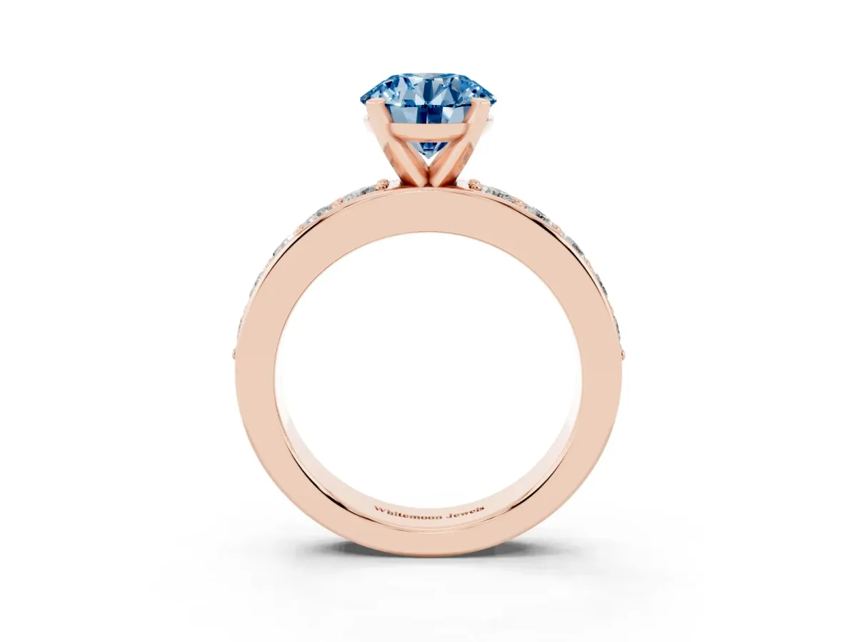 Fancy Blue Round Cut Diamond Engagement Ring with Channel Set Round Band and Prong Setting Rose gold