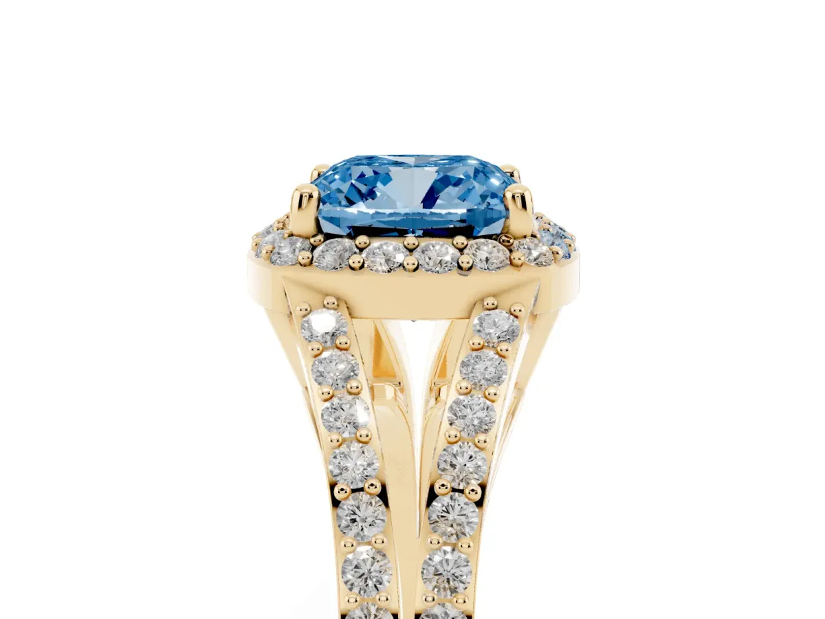 Fancy Blue Cushion Cut Halo Split Shank Pave Diamond Ring with Four-Prong Setting Yellow gold