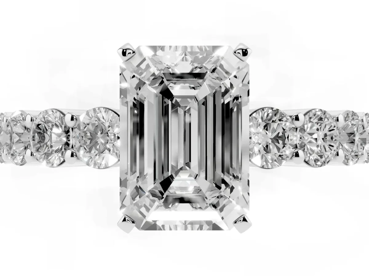 Emerald Cut Diamond Solitaire Ring with Shared Prong Round Side Stones Platinum
