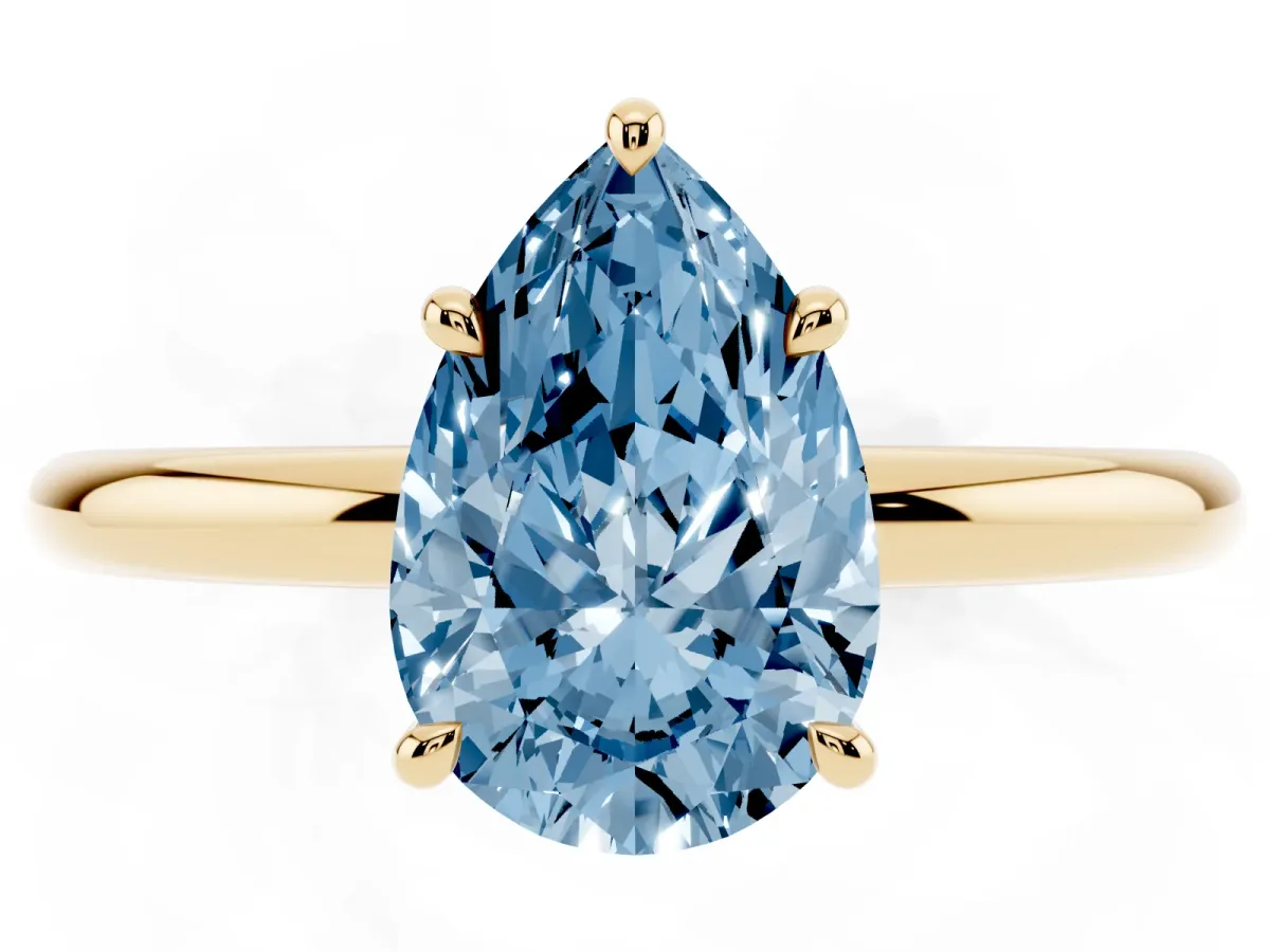 Fancy Blue Pear Cut Diamond Solitaire Ring with Thin Band and Four-Prong Setting Yellow gold