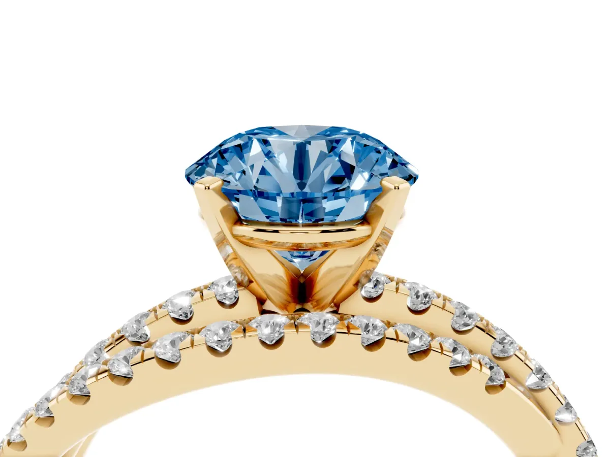 Fancy Blue Round Cut Solitaire Twist Band with Pavé Setting and Four-Prong Setting Yellow gold