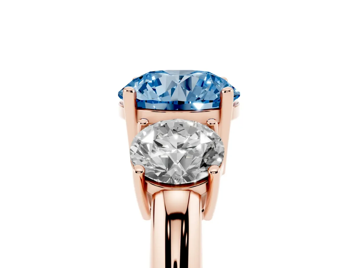 Fancy Blue Three-Stone Round Cut Cut Diamond Engagement Ring with Prong Setting on a White Gold Band Rose gold