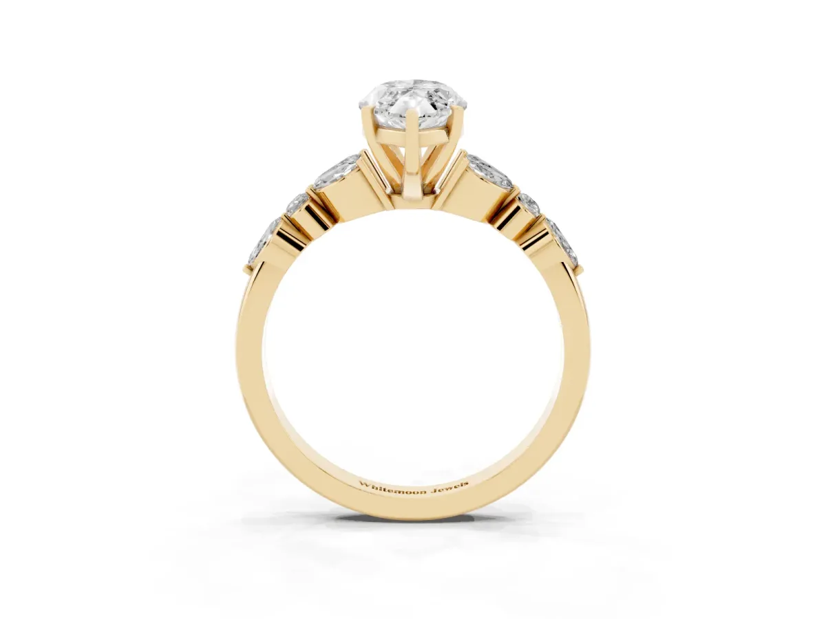Marquise Cut Diamond Solitaire Ring with Side Stones and Four-Prong Setting Yellow gold