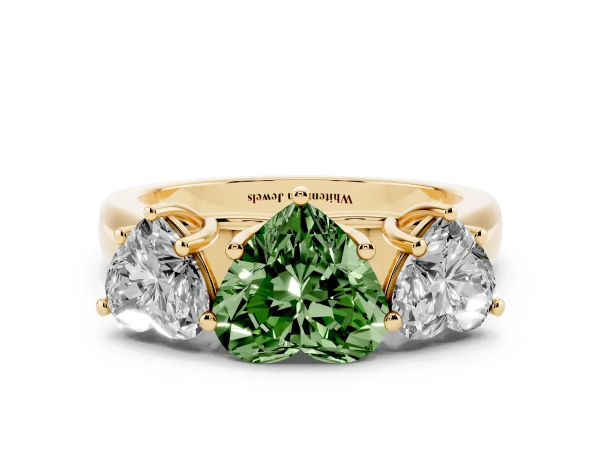 Fancy Green Heart Cut Three-Stone Diamond Ring with Prong Setting on a Classic Band Yellow gold