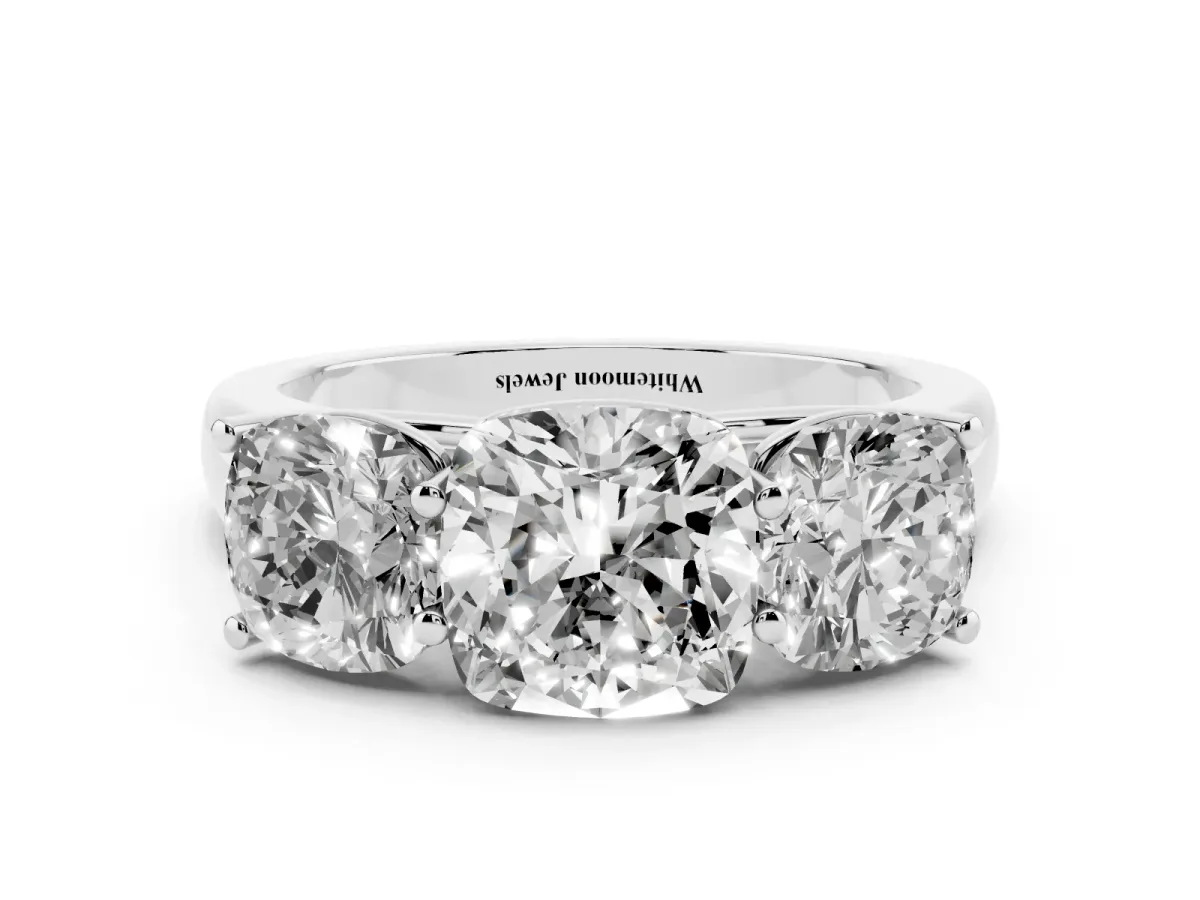Cushion Cut Three-Stone Diamond Ring with Prong Setting on a Classic Band Silver