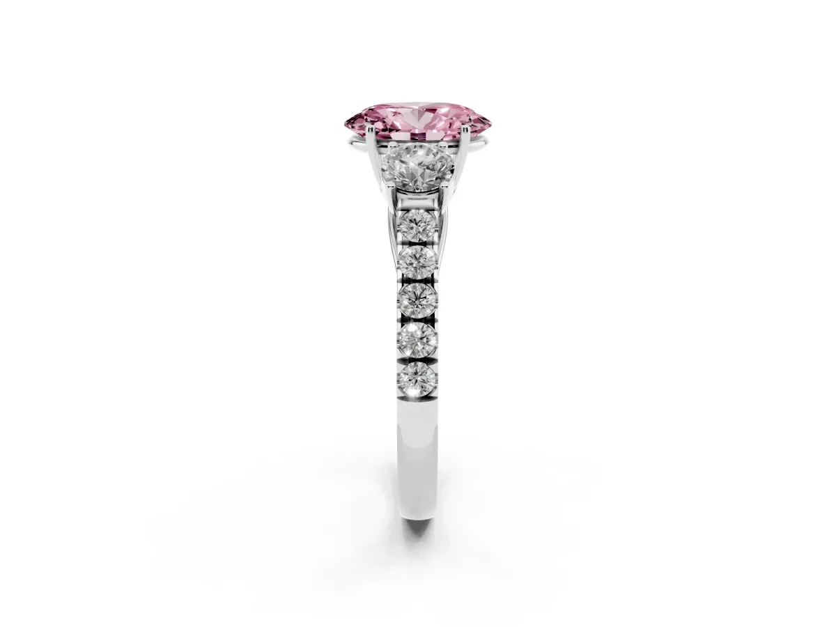 Fancy Pink Oval Cut Cut Diamond Three-Stone Ring with Round Side Stones and Pavé Band Silver