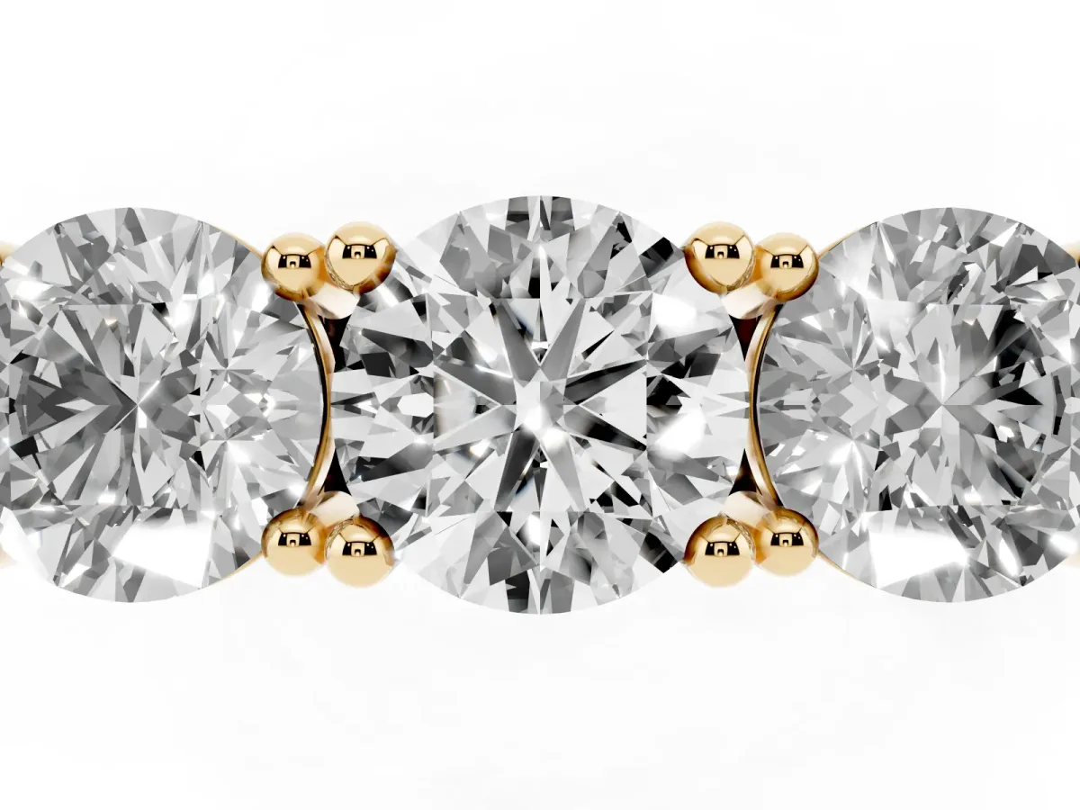 Three-Stone Round Cut Diamond Channel Band with Prong Setting Yellow gold