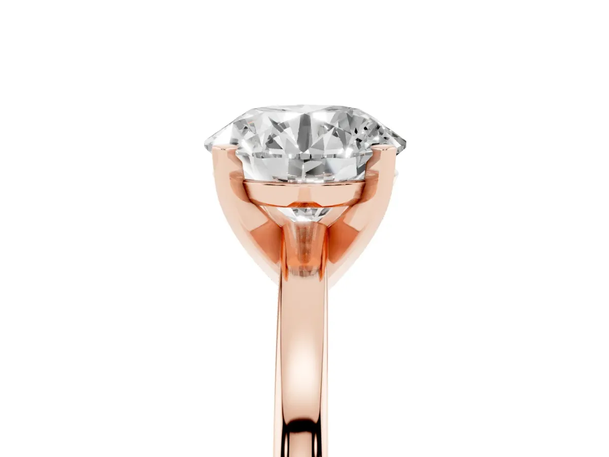 Round Cut Solitaire Diamond Engagement Ring with Four-Prong Setting on a Classic Band Rose gold
