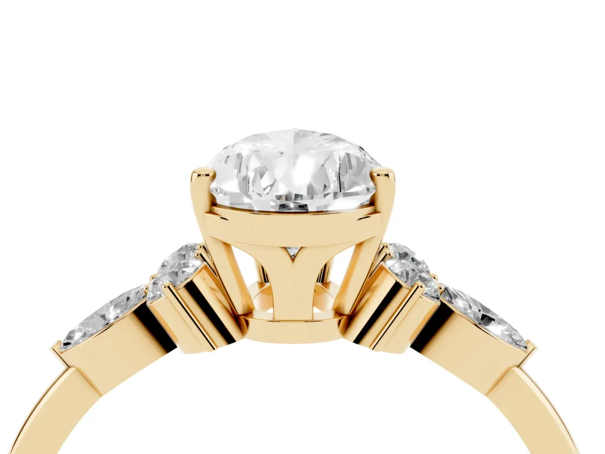Pear Cut Brilliant Diamond Solitaire Ring with Pear Side Stones and Four-Prong Setting Yellow gold